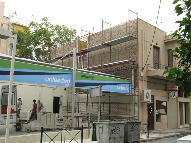 Scaffolding on a building with shops